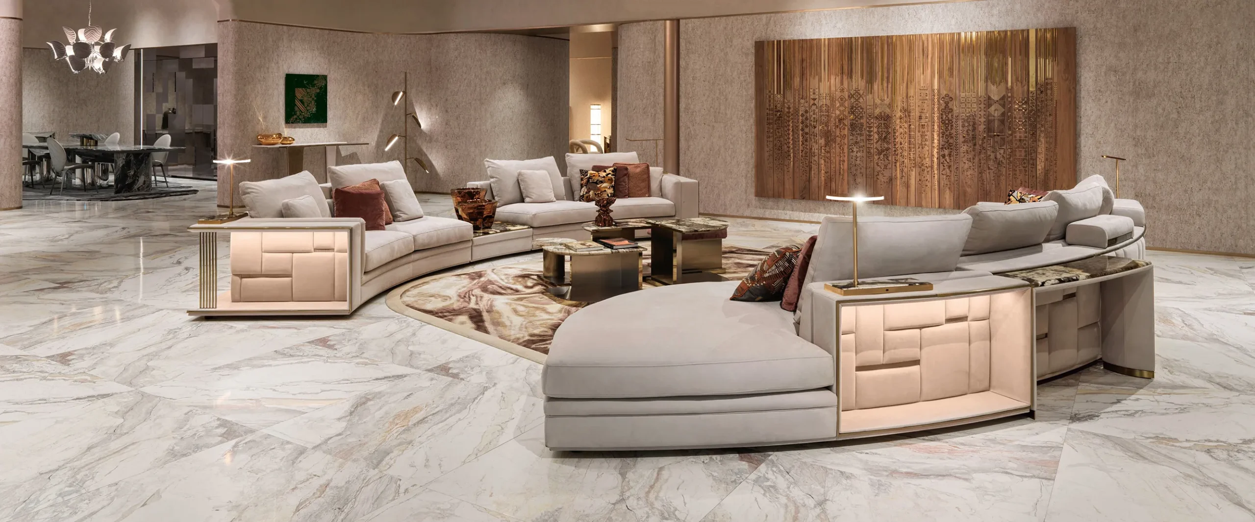 Contemporary living room with white sofas, marble flooring and sculptural wall art